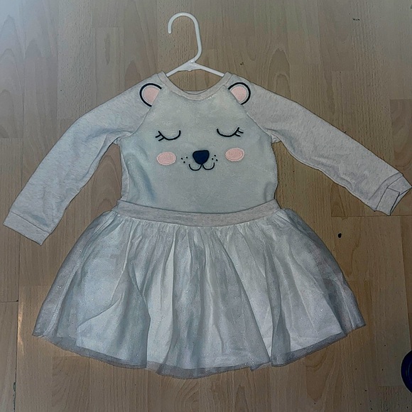 Four long sleeve shirts with ruffles at the end. - Picture 1 of 3